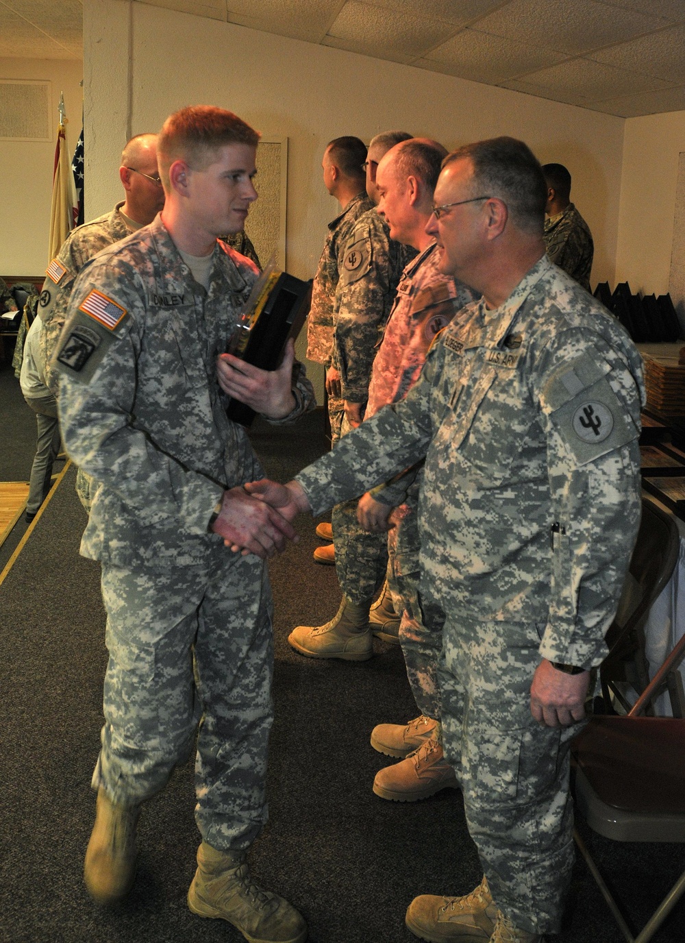 Soldiers of the 649th Regional Support Group of Cedar Rapids are presented with awards during a Warrior Welcome Home Ceremony