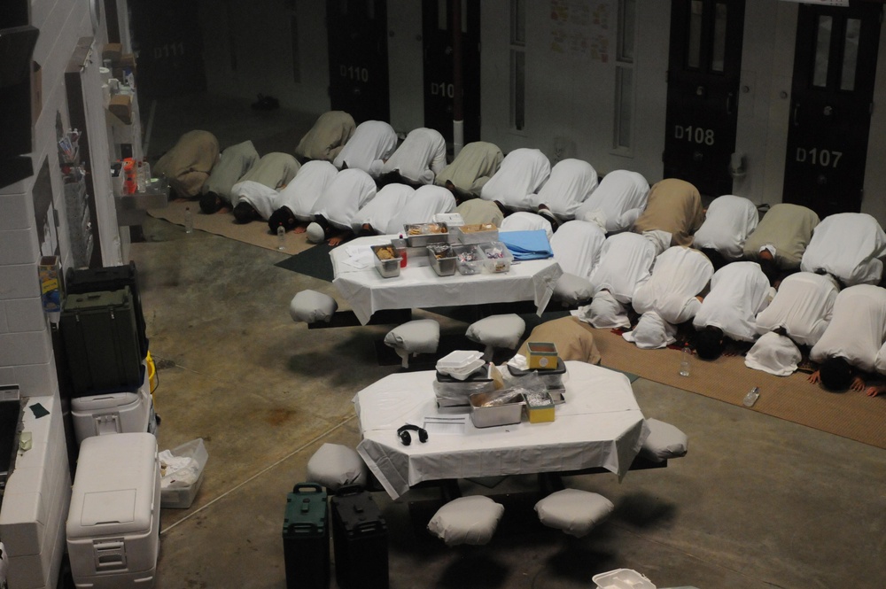 Detainees pray in a communal area of Camp Six at Joint Task Force Guantanamo