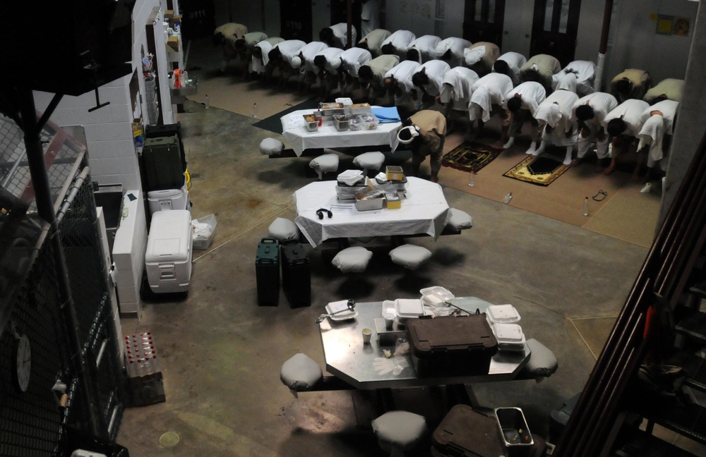 Detainees pray in a communal area of Camp Six at Joint Task Force Guantanamo