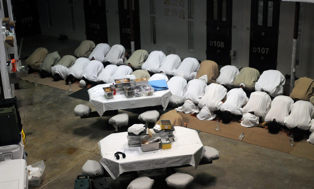 Detainees pray in a communal area of Camp Six at Joint Task Force Guantanamo