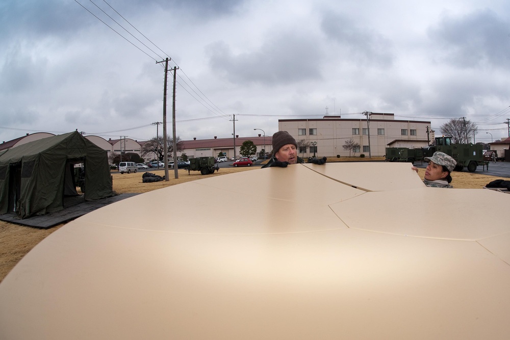 Tents provide additonal workspace at Yokota