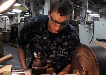 USS Frank Cable Sailor Repairs Paper Pin