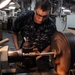 USS Frank Cable Sailor Repairs Paper Pin