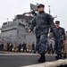 Sailors and Marines Prepare to Man the Rails Aboard the USS Bataan