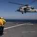 Sailor Directs MH-60S Sea Hawk Aboard USS Whidbey Island