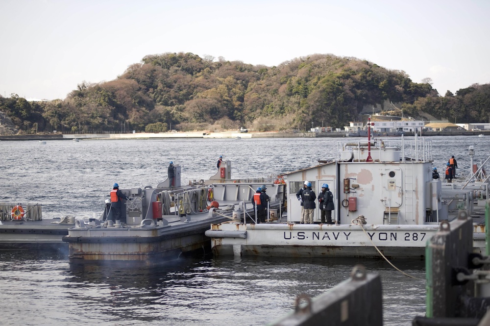 U.S. Navy Barge filled with fresh water, departs Fleet Activities Yokosuka to support cooling efforts at the Fukushima Daiichi nuclear power plant