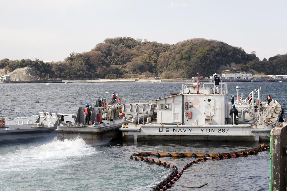 US Navy Barge filled with fresh water, departs Fleet Activities Yokosuka to support cooling efforts at the Fukushima Daiichi nuclear power plant
