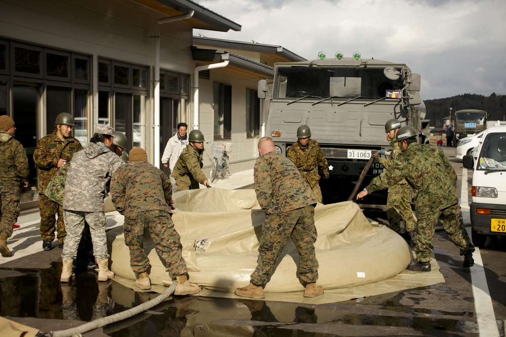 JSF-J deliver showers to local citizens