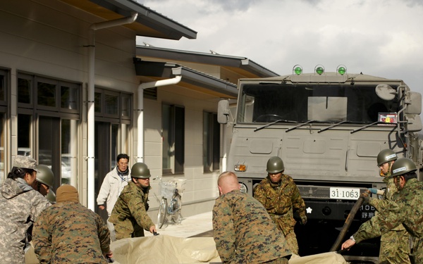 JSF-J deliver showers to local citizens