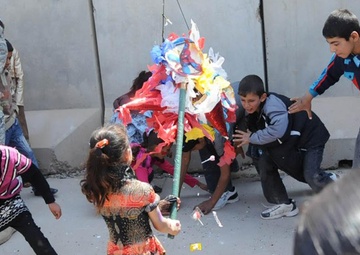 Bringing smiles to Iraqi kids: Iraqi Kids Day brings US personnel, Iraqi locals together