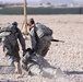 During a training exercise, troops drag their comrade to safety