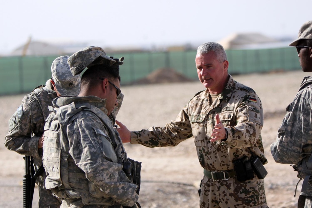 A German Soldier shares tactical knowledge with American combat Troops