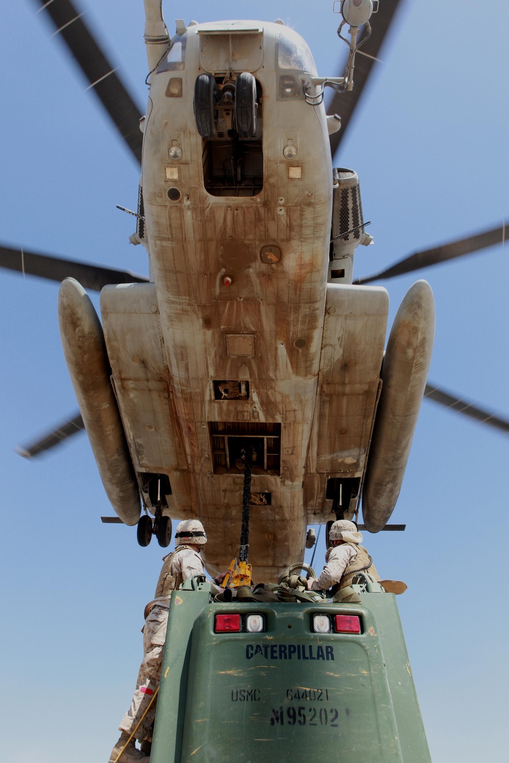 Helicopter support team sends heavy equipment via air