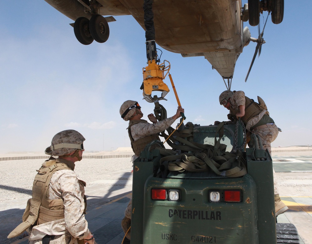 Helicopter support team sends heavy equipment via air