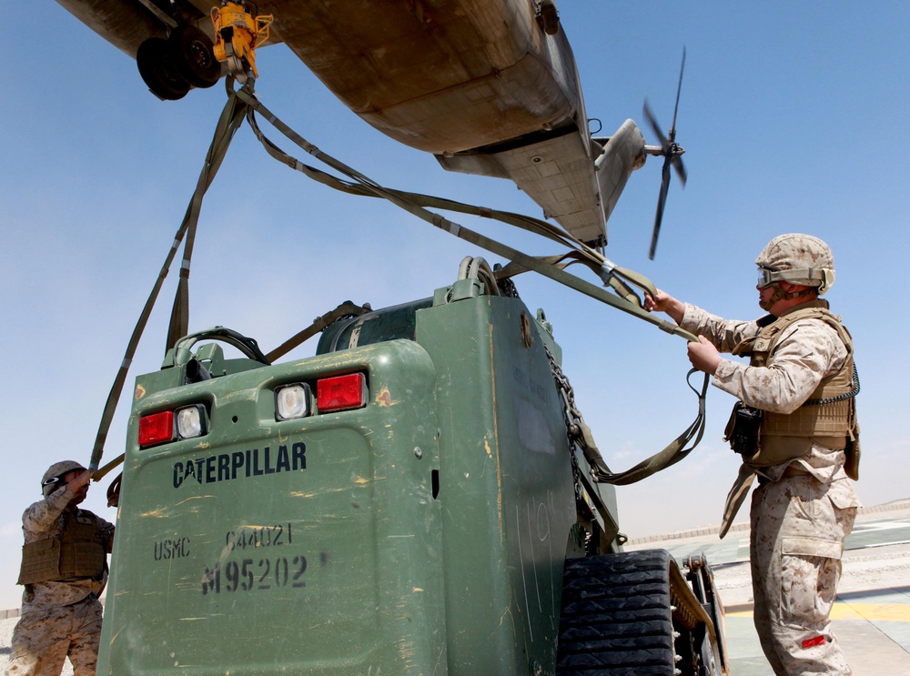 Helicopter support team sends heavy equipment via air