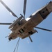Helicopter support team sends heavy equipment via air