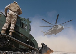 Helicopter support team sends heavy equipment via air