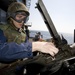 Sailors fire machine gun