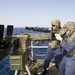 Sailors fire machine gun