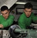 USS John C. Stennis Sailors Work on a Tow Tractor