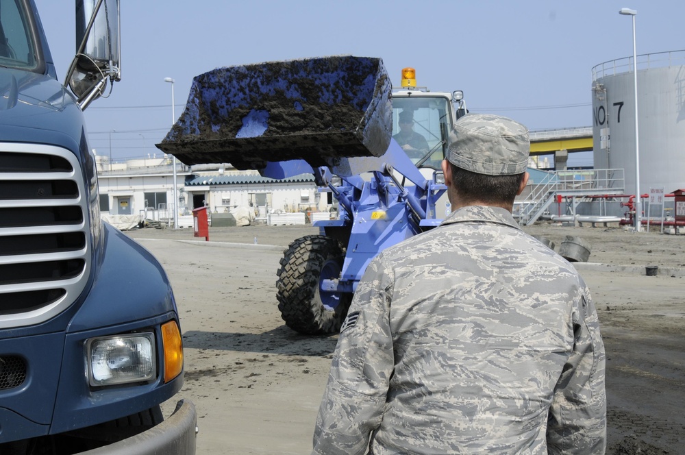 Japanese Military, City Workers Help with Naval Fuel Station Cleanups