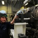 USS Ronald Reagan Sailors Work on Jet Engine