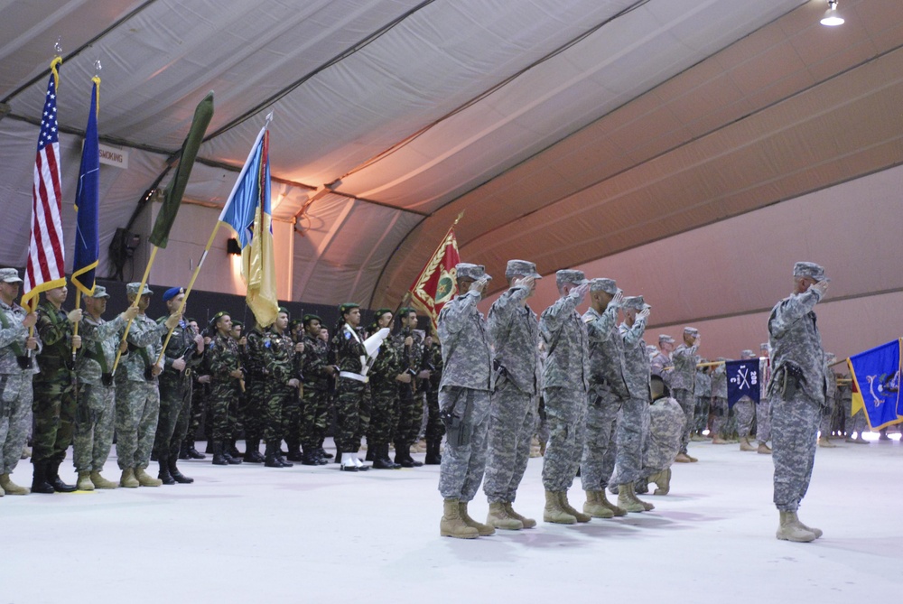 Multinational soldiers present arms