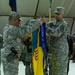 Incoming commander and sergeant major uncase their colors during transfer of authority ceremony in Kosovo