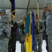 Incoming commander and sergeant major uncase their colors during transfer of authority ceremony in Kosovo