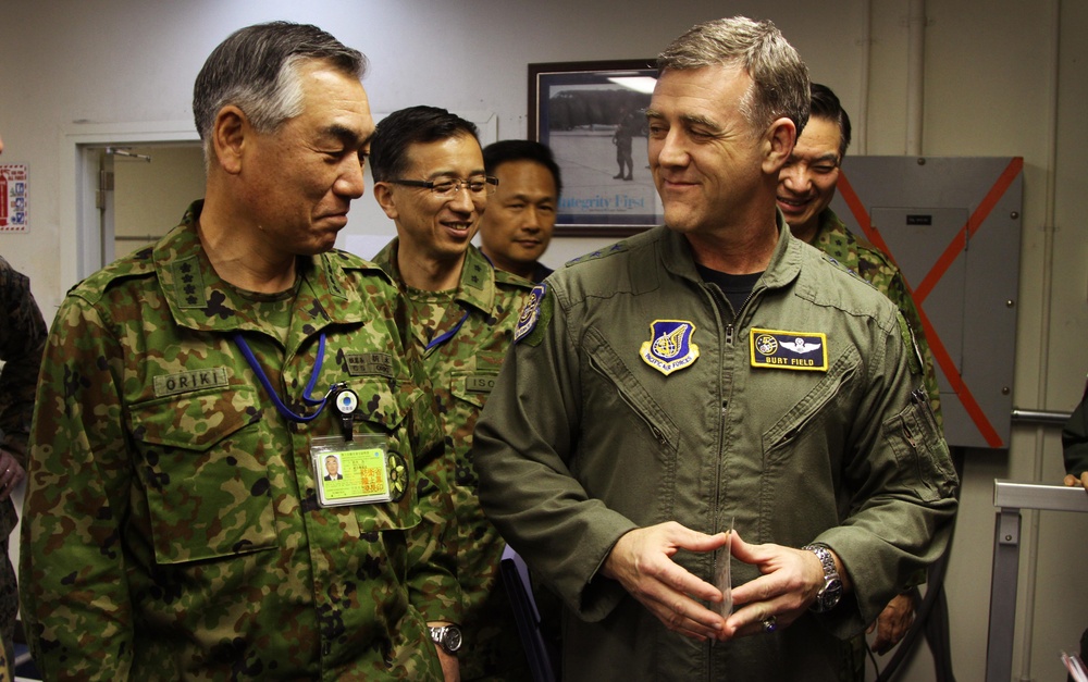 Gen. Ryoichi Oriki, Chief of Staff, Joint Staff, Japan (left) is provided an overview of the Joint Support Force headquarters operations by Lt. Gen. Burton M. Field, Deputy Commander, Joint Support Force