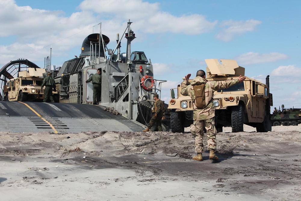 22nd MEU Marines load vehicles aboard landing craft