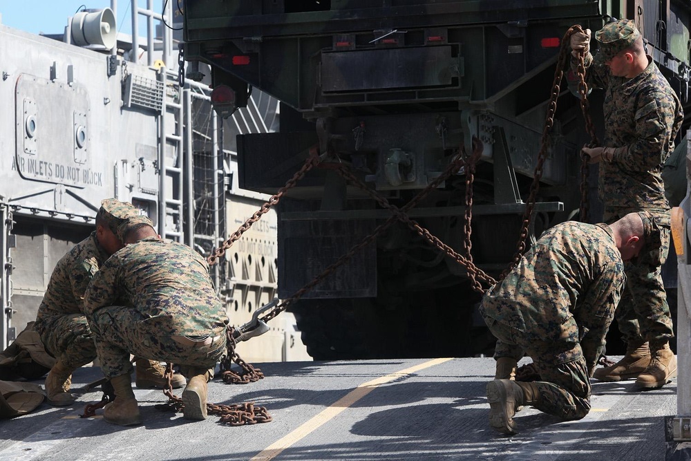 22nd MEU Marines load vehicles aboard landing craft