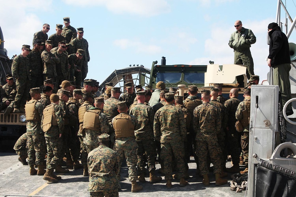 22nd MEU Marines load vehicles aboard landing craft