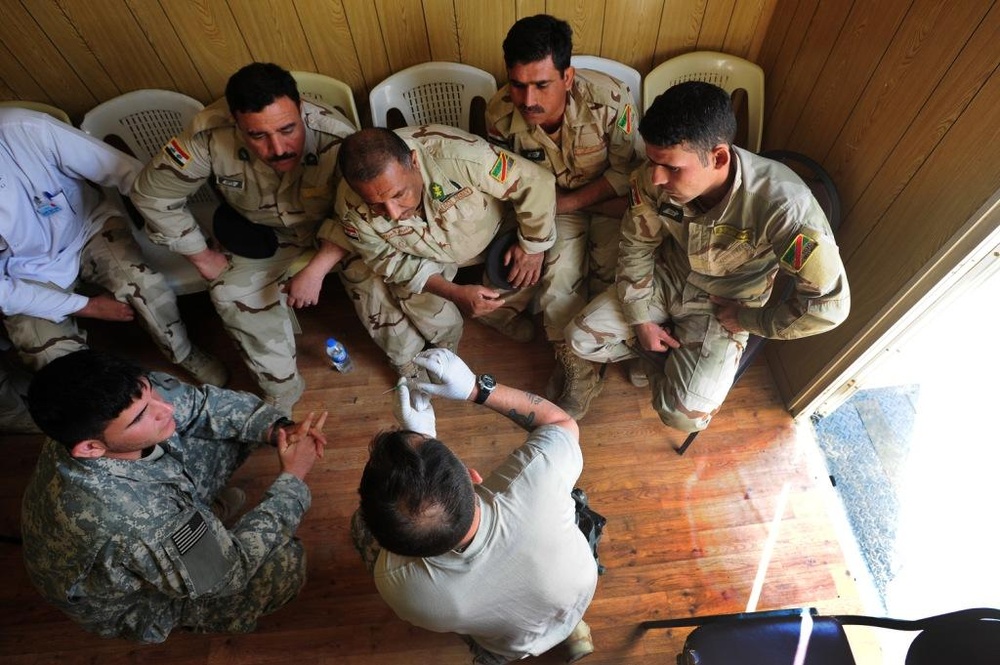 1st Bn., 18th Inf. Regt. Soldiers work with 9th IA Div. on medical tasks, tanks