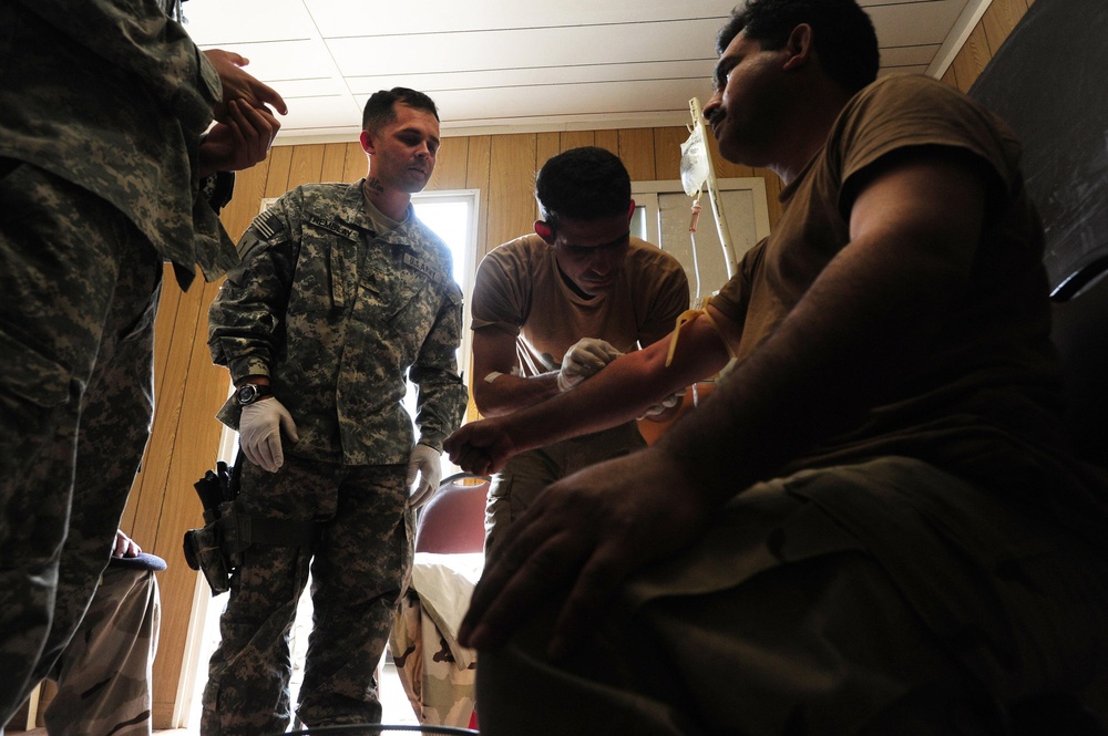 1st Bn., 18th Inf. Regt. Soldiers work with 9th IA Div. on medical tasks, tanks