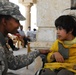 Vanguard Brigade Soldiers help distribute wheelchairs to disabled Iraqi children