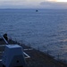 Canadian mine sweepers sit off the starboard bow of guided missile destroyer USS Forrest Sherman (DDG 98) during a fast attack craft drill.