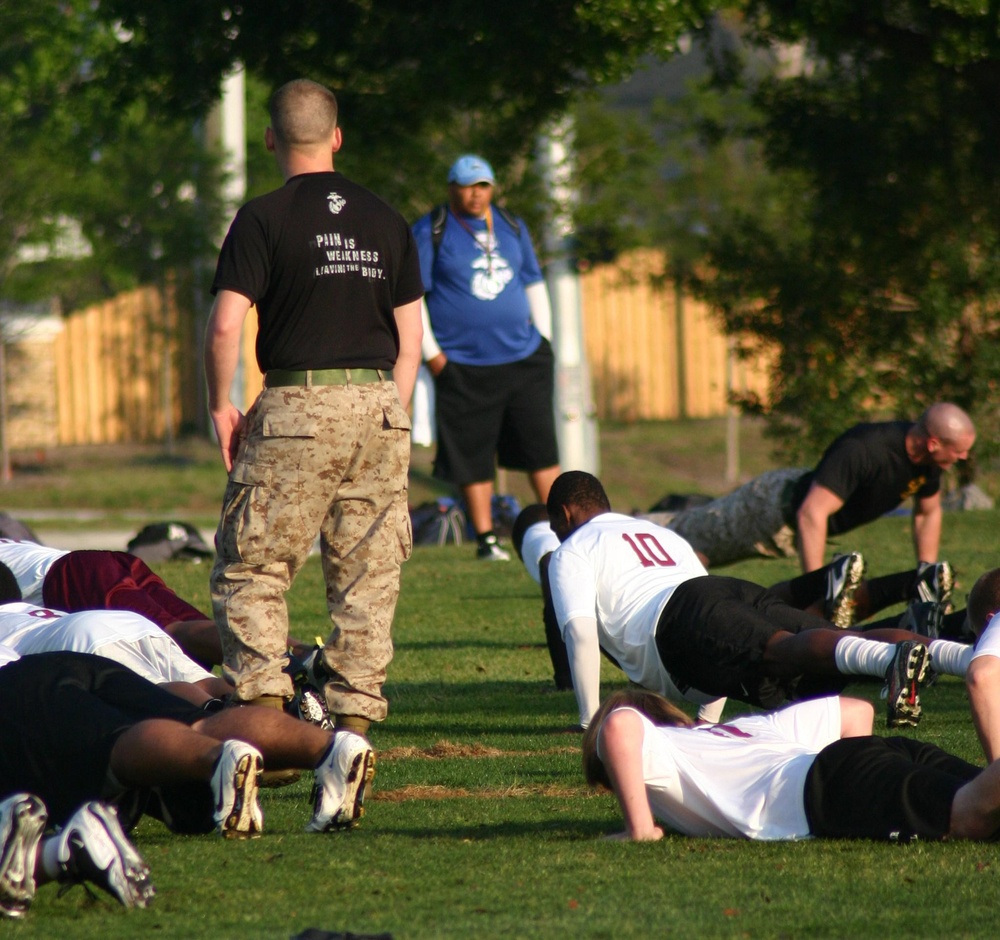 Marines partner with youth football camp