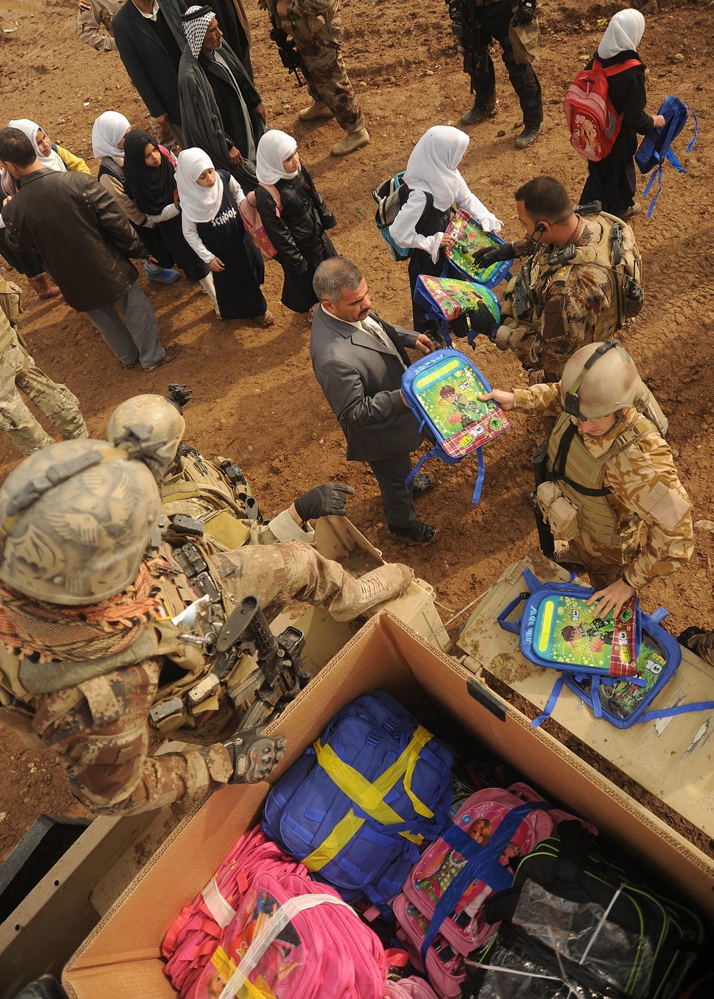 Iraqi Special Operations Forces Hand Out Backpacks