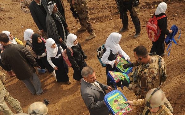 Iraqi Special Operations Forces Hand Out Backpacks