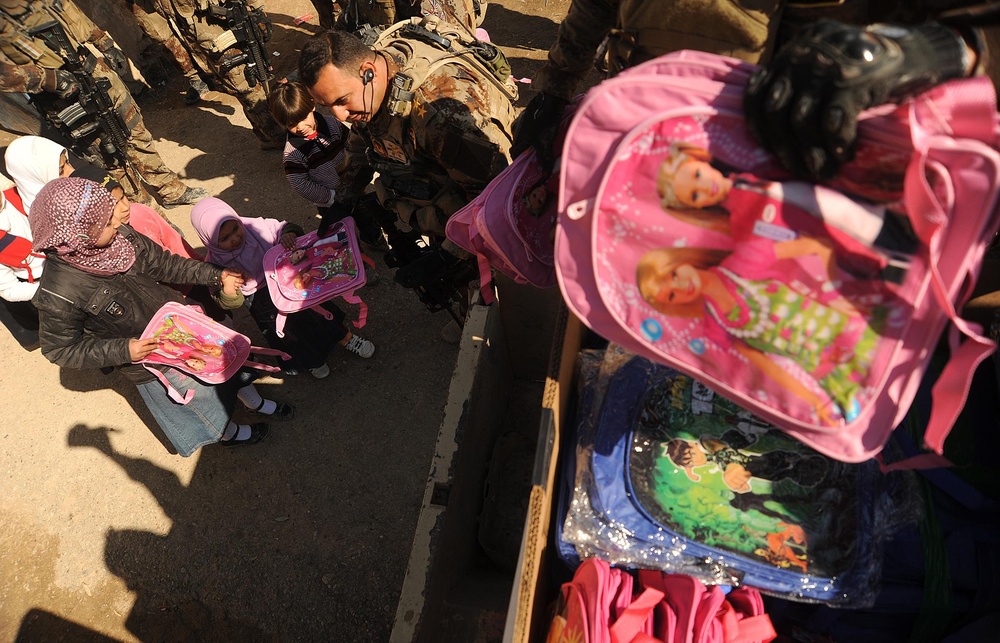 Iraqi Special Operations Forces Distribute Backpacks to School Children