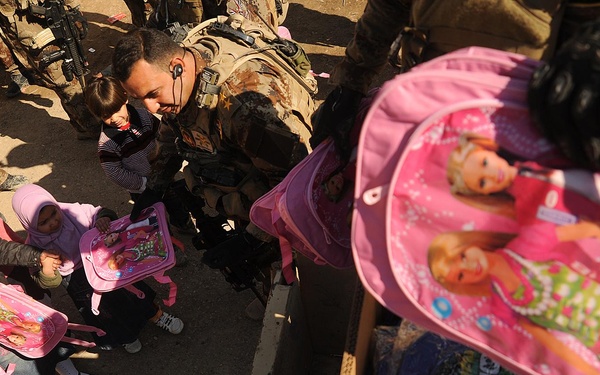 Iraqi Special Operations Forces Distribute Backpacks to School Children