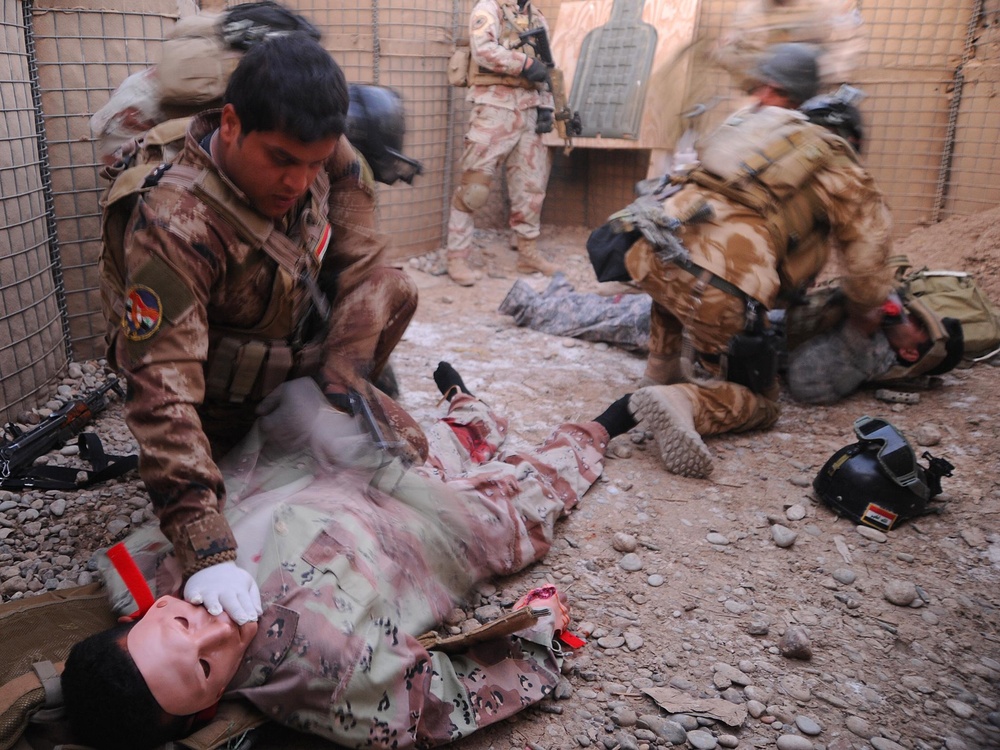 Iraqi Medi Treats Casualty During Training Exercise