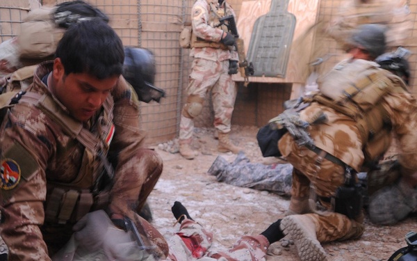 Iraqi Medi Treats Casualty During Training Exercise
