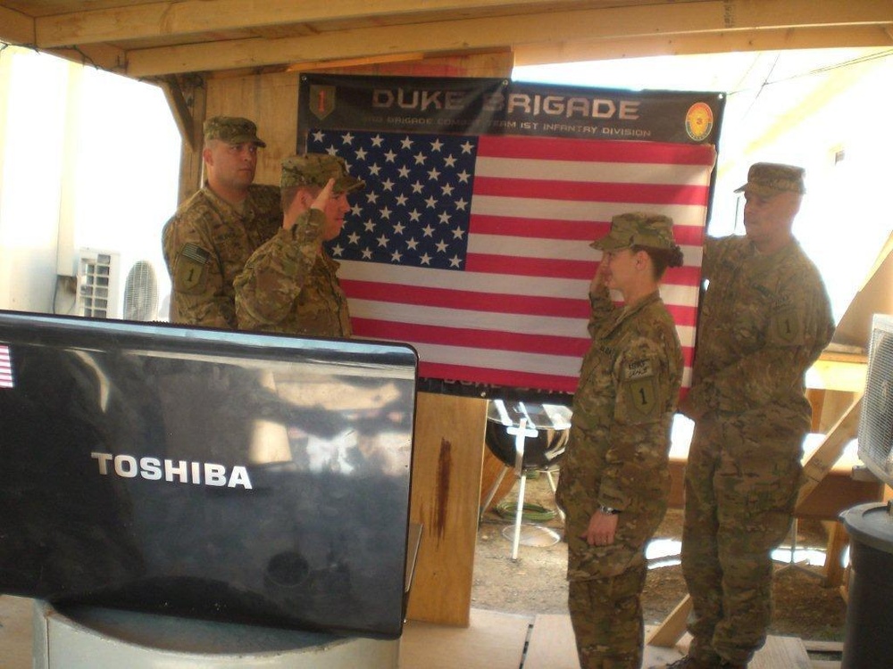 Spouses at home attend re-enlistments downrange