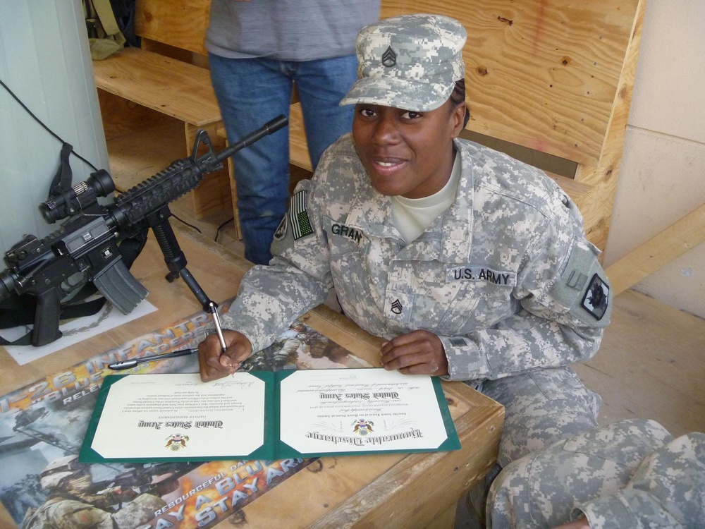 Spouses at home attend re-enlistments downrange