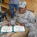 Spouses at home attend re-enlistments downrange
