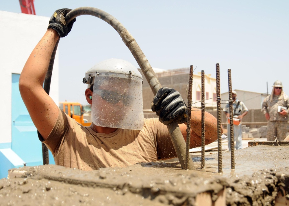 Sailors work on school