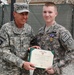 Petraeus decorates soldier with Purple Heart