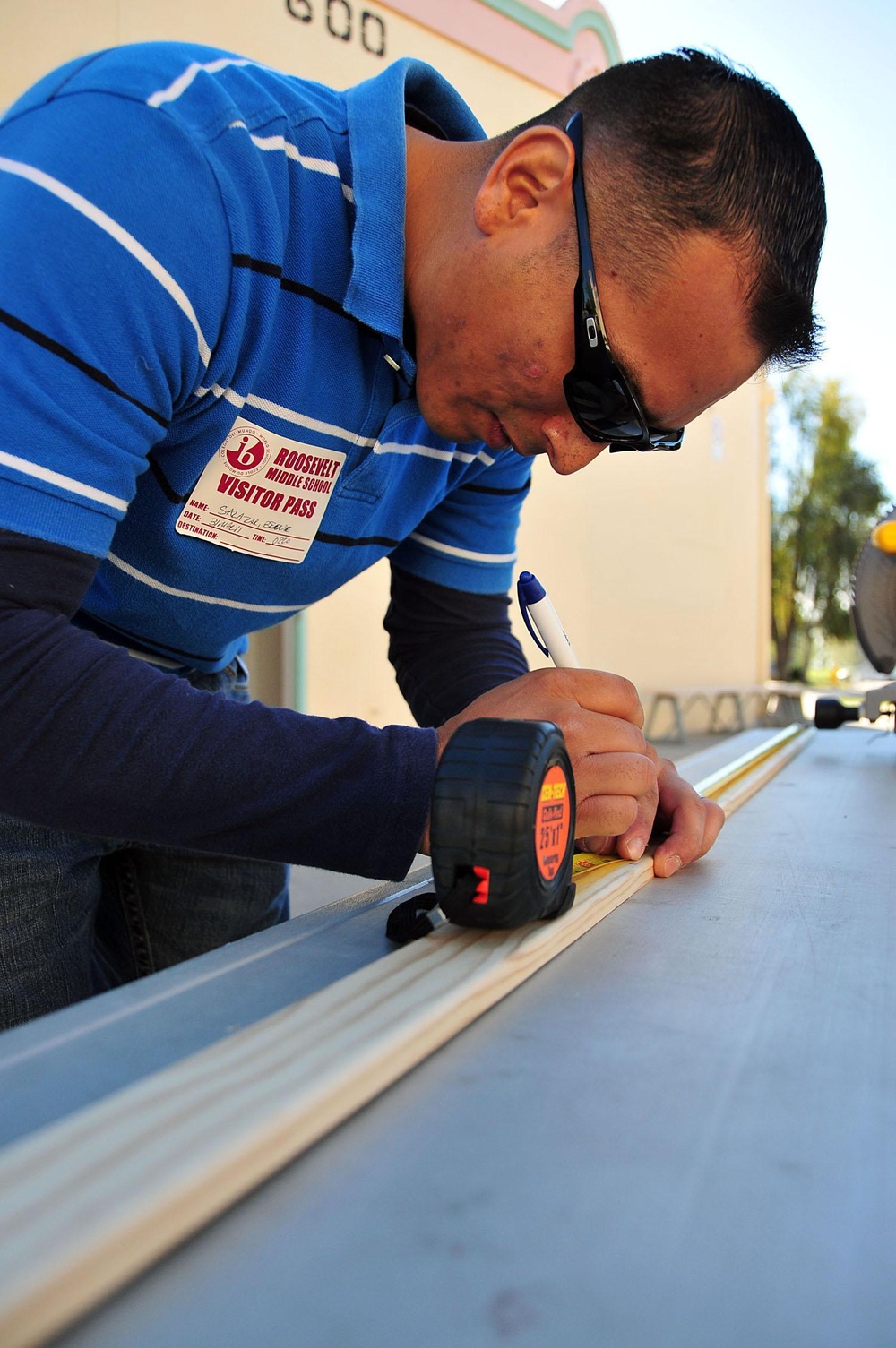 Sailor Builds Bulletin Board During Community Outreach Project